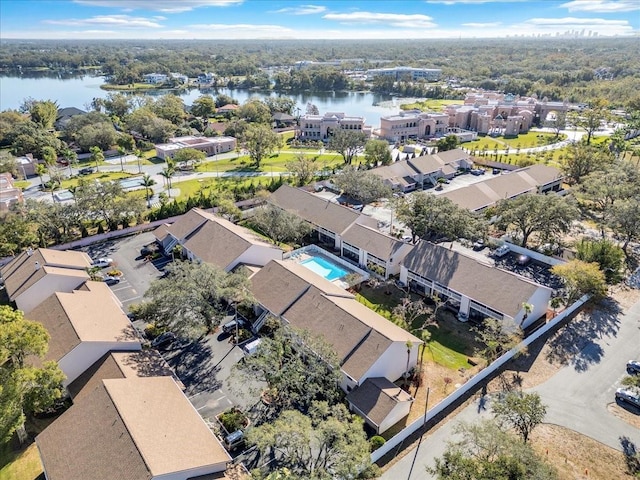 drone / aerial view featuring a water view and a residential view