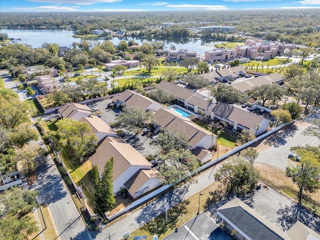 birds eye view of property featuring a residential view and a water view