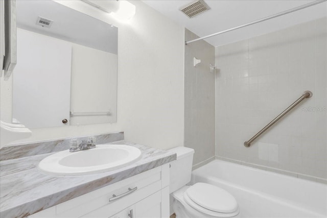 bathroom with visible vents, vanity, toilet, and tub / shower combination