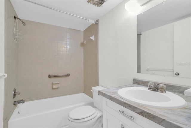 bathroom featuring toilet, bathing tub / shower combination, vanity, and visible vents