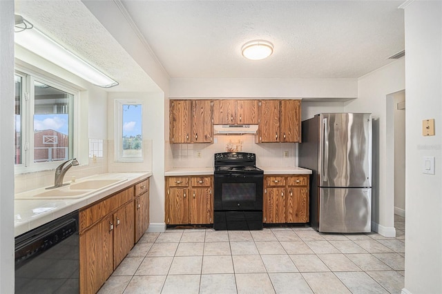 kitchen featuring stainless steel fridge, a textured ceiling, sink, dishwasher, and black electric range oven