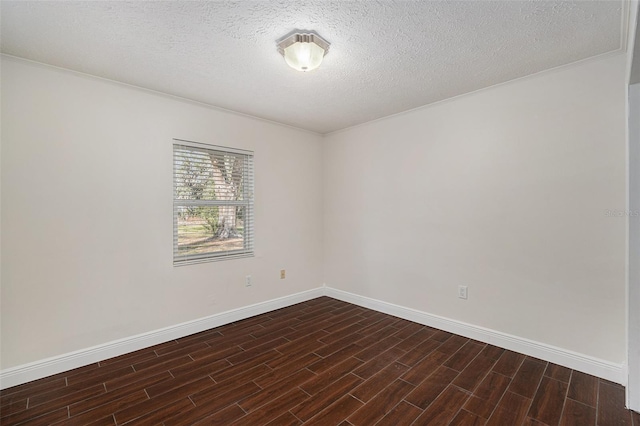 unfurnished room featuring crown molding, dark wood-type flooring, and a textured ceiling