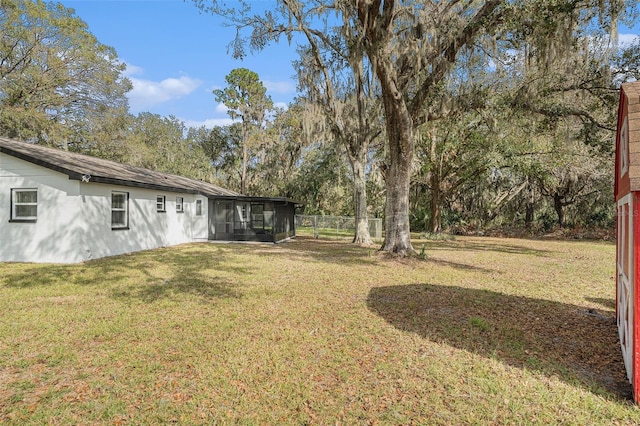 view of yard with a sunroom