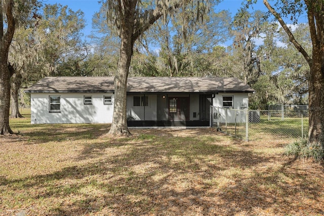 rear view of house with a lawn