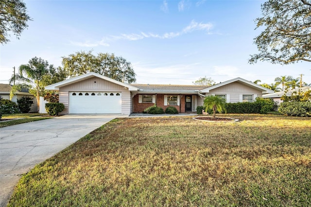 single story home with a front yard and a garage