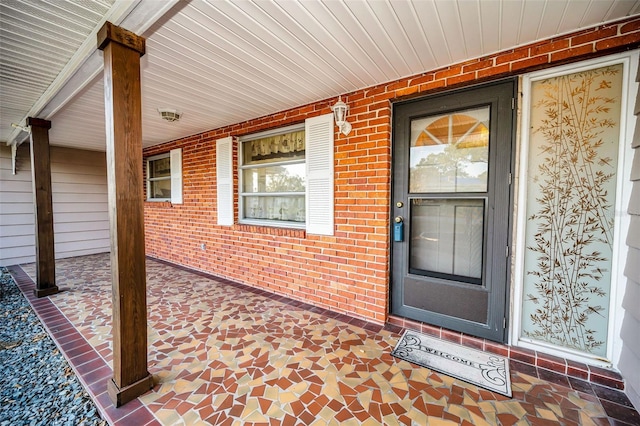 doorway to property featuring covered porch