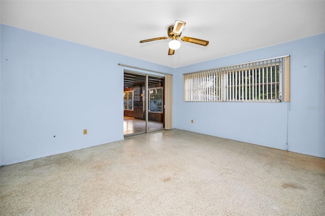 unfurnished room with ceiling fan