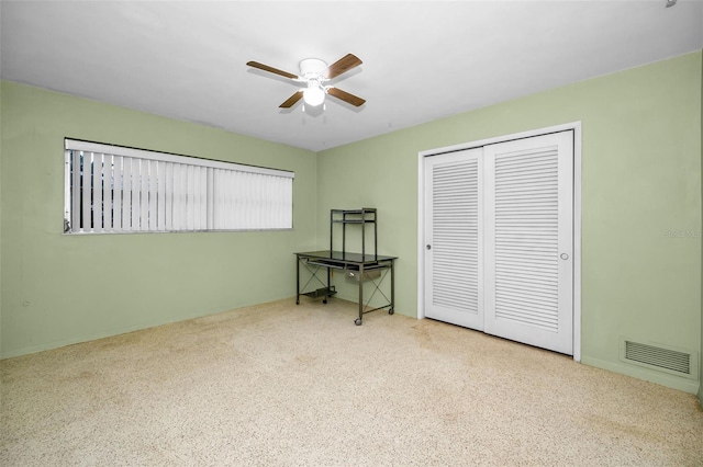 bedroom featuring ceiling fan and a closet