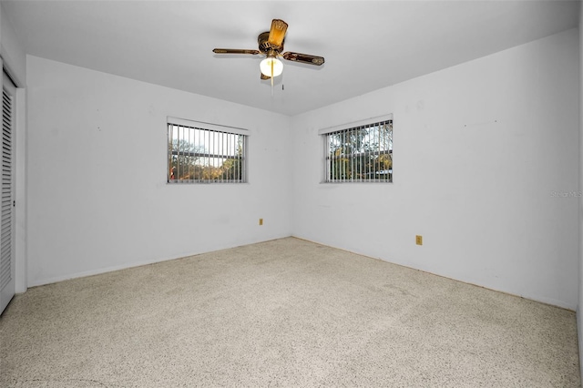 unfurnished room with ceiling fan