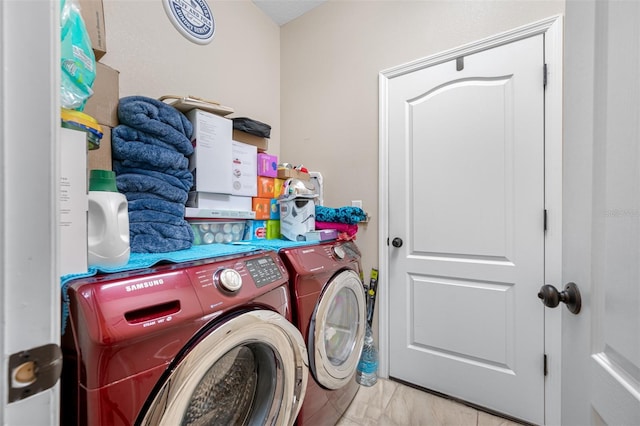 washroom with washing machine and dryer