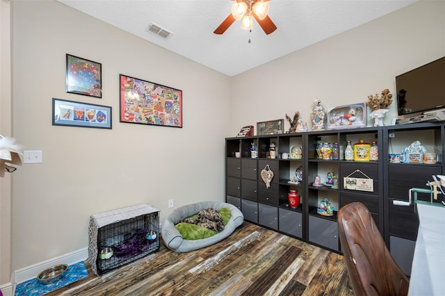 office space with ceiling fan, wood-type flooring, and a textured ceiling