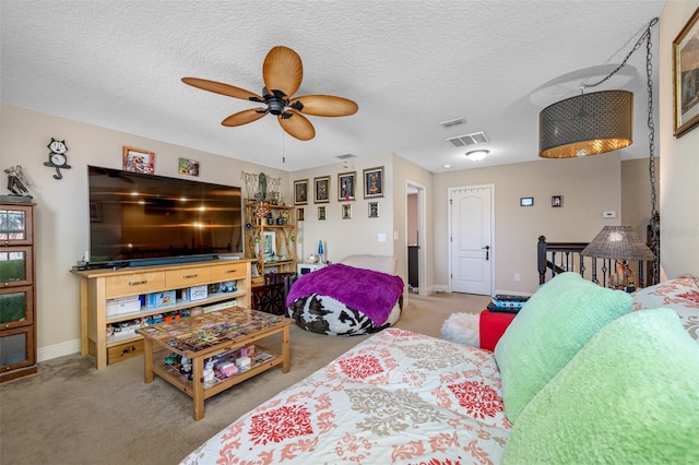 carpeted living room with ceiling fan and a textured ceiling