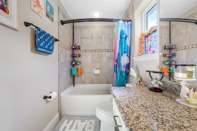 full bathroom with shower / tub combo, vanity, and toilet