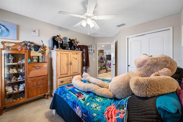 bedroom featuring ceiling fan and light colored carpet