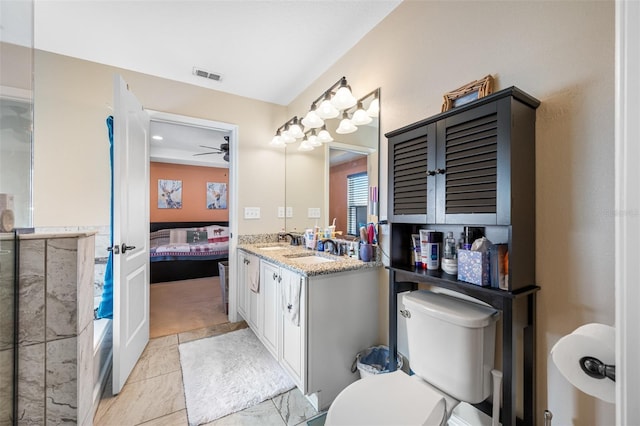 bathroom featuring tile patterned flooring, vanity, ceiling fan, and toilet