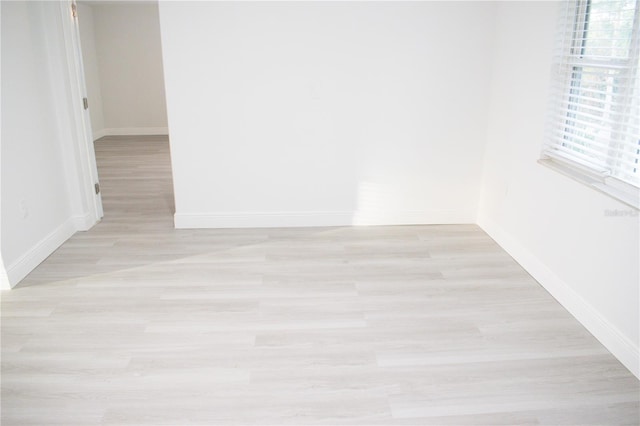 spare room with light hardwood / wood-style flooring