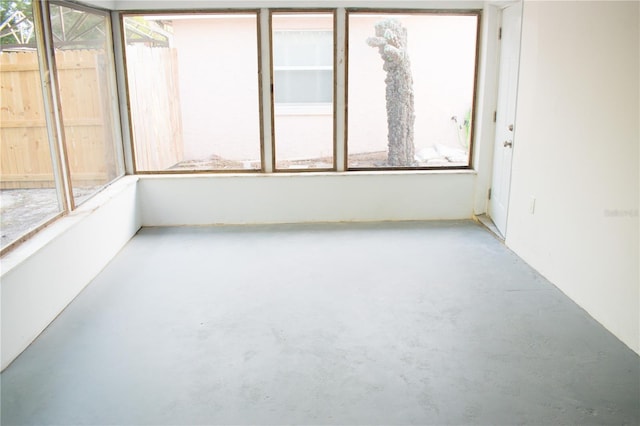 unfurnished sunroom with plenty of natural light