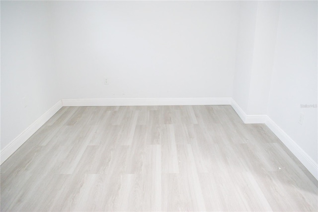 empty room with light hardwood / wood-style floors