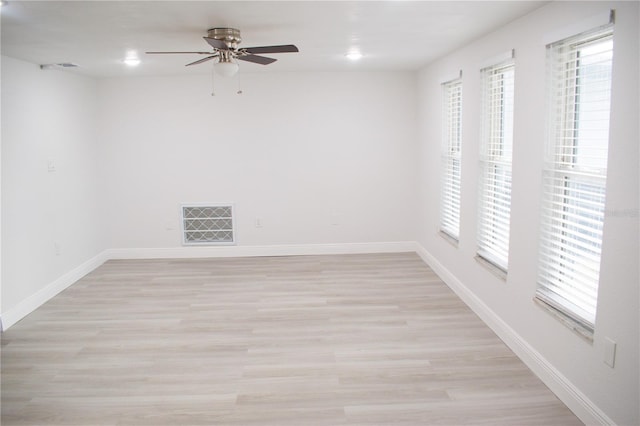 spare room featuring ceiling fan and light hardwood / wood-style floors