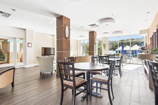 470 3rd St S Unit 405, Saint Petersburg, FL 33701 - dining area with wood finished floors and baseboards