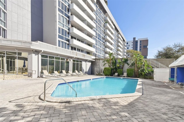 view of swimming pool with a patio area