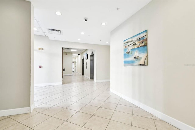 hall with light tile patterned flooring