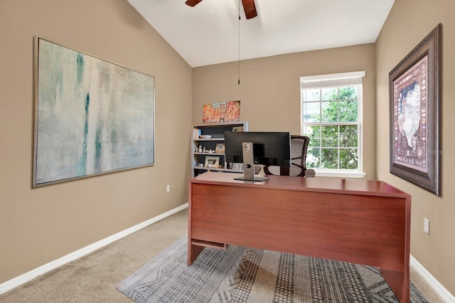 carpeted office featuring ceiling fan and vaulted ceiling