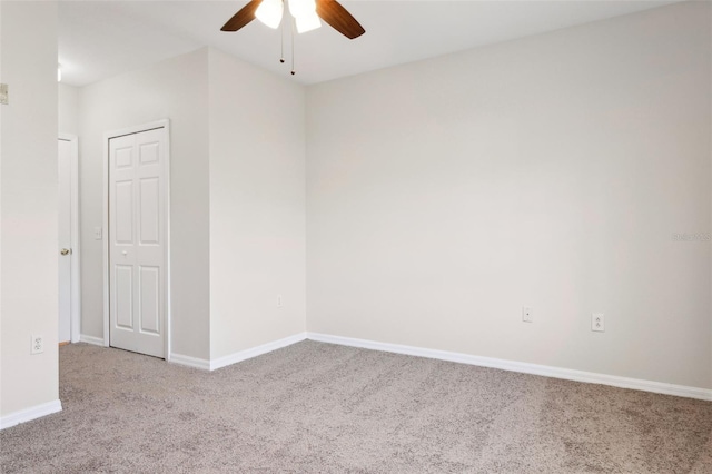 carpeted empty room with ceiling fan