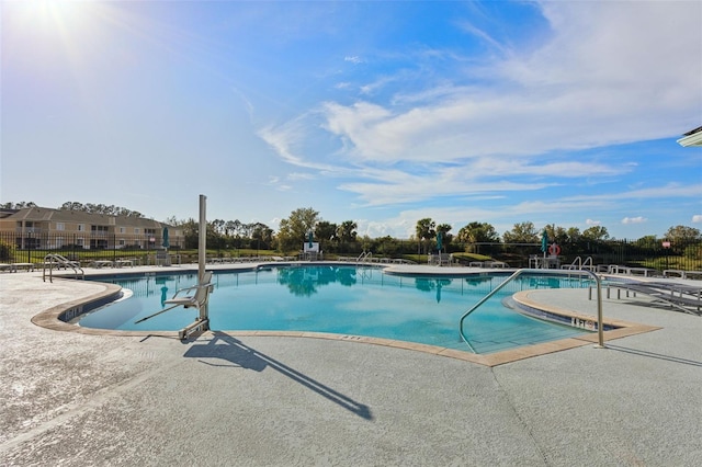 view of swimming pool with a patio area