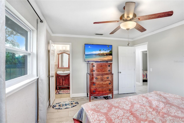 bedroom with ceiling fan, crown molding, connected bathroom, and multiple windows