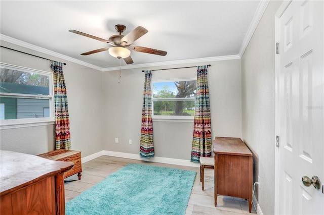 interior space featuring ceiling fan and crown molding