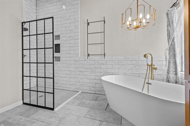 full bathroom featuring a soaking tub, a notable chandelier, tile walls, and a walk in shower