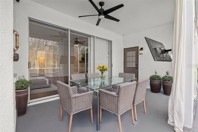 view of patio featuring ceiling fan and outdoor dining space