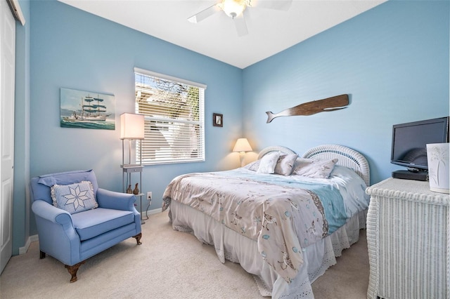 bedroom featuring ceiling fan and light colored carpet