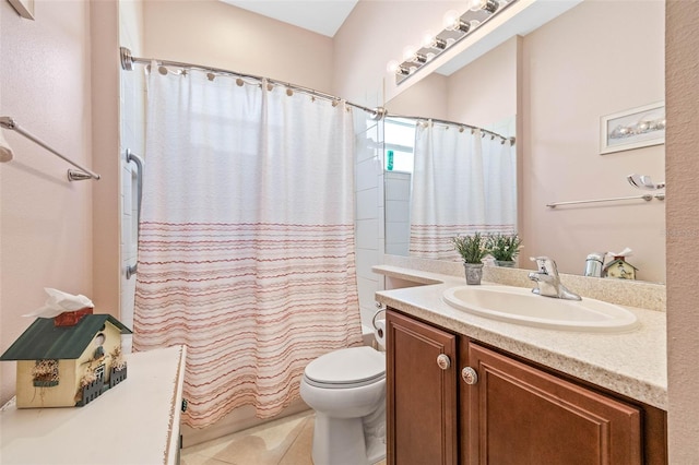 bathroom featuring tile patterned floors, vanity, and toilet