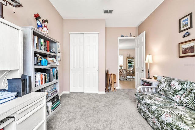 living area with light carpet