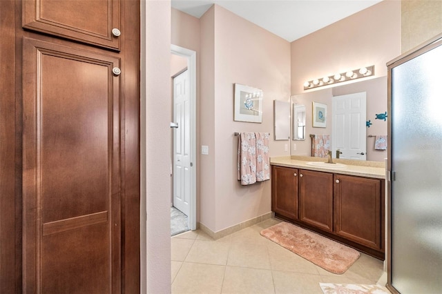 bathroom featuring tile patterned flooring and vanity