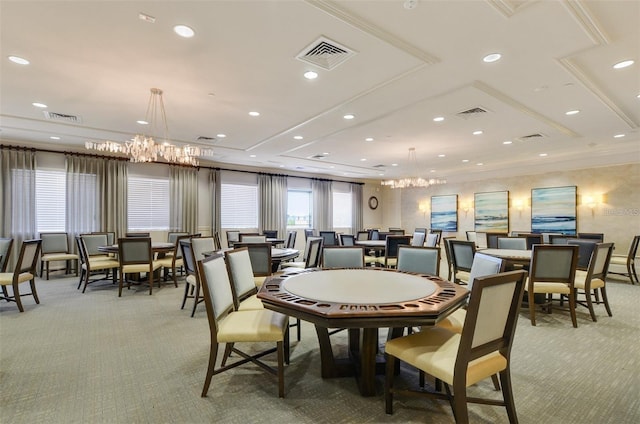 dining room featuring light colored carpet and a notable chandelier