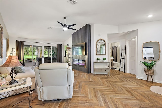 living room with light parquet floors, ceiling fan, and lofted ceiling