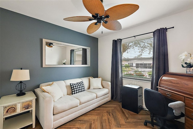 office area with ceiling fan and dark parquet floors