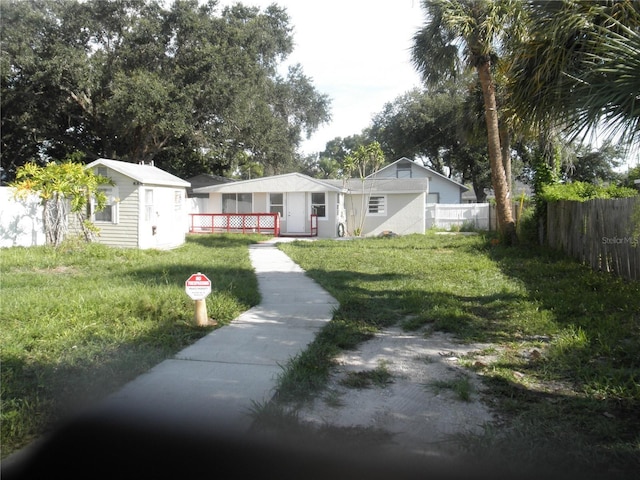 view of front of home featuring an outbuilding