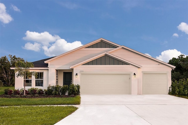 view of front of house with a front lawn and a garage