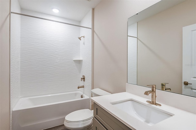 full bathroom featuring bathing tub / shower combination, vanity, and toilet