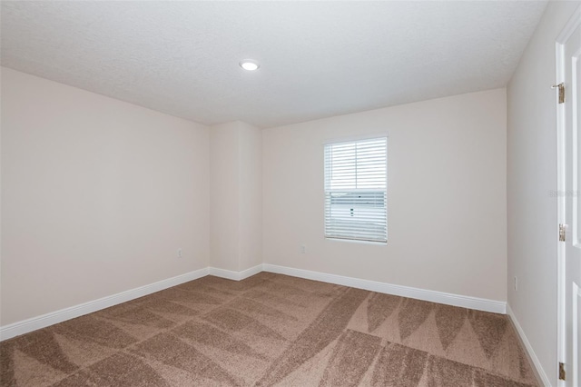 empty room featuring carpet flooring