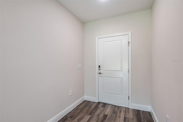 doorway with dark hardwood / wood-style flooring