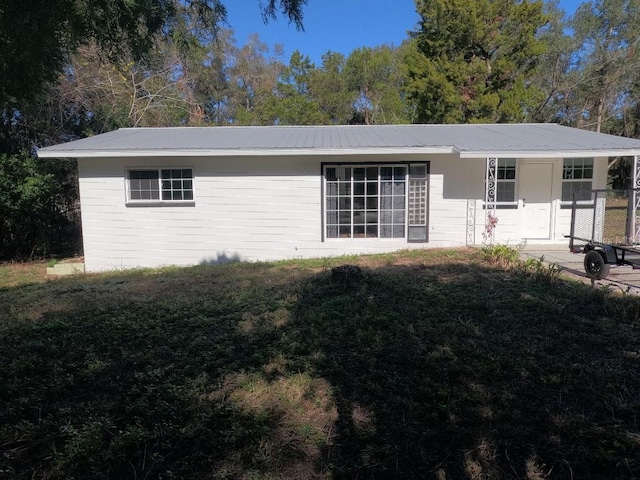 back of house featuring a porch