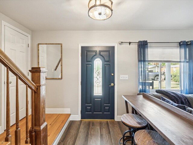 foyer with dark hardwood / wood-style flooring