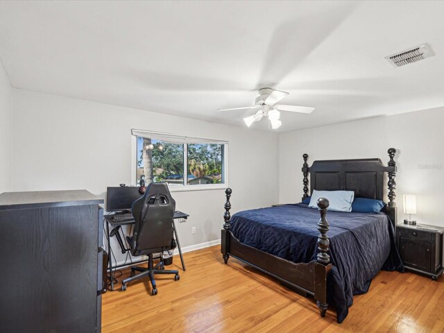 bedroom with ceiling fan and light hardwood / wood-style floors