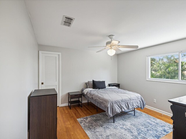 bedroom with ceiling fan and light hardwood / wood-style flooring