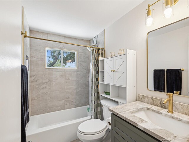 full bathroom featuring vanity, shower / bathtub combination with curtain, and toilet